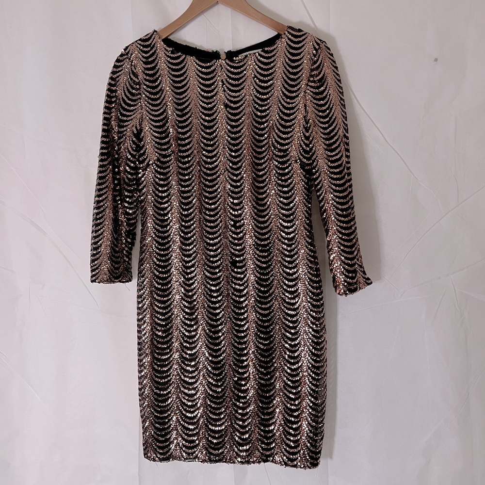 Gold and black, sequin patty dress, stretchy, perfect for a party.